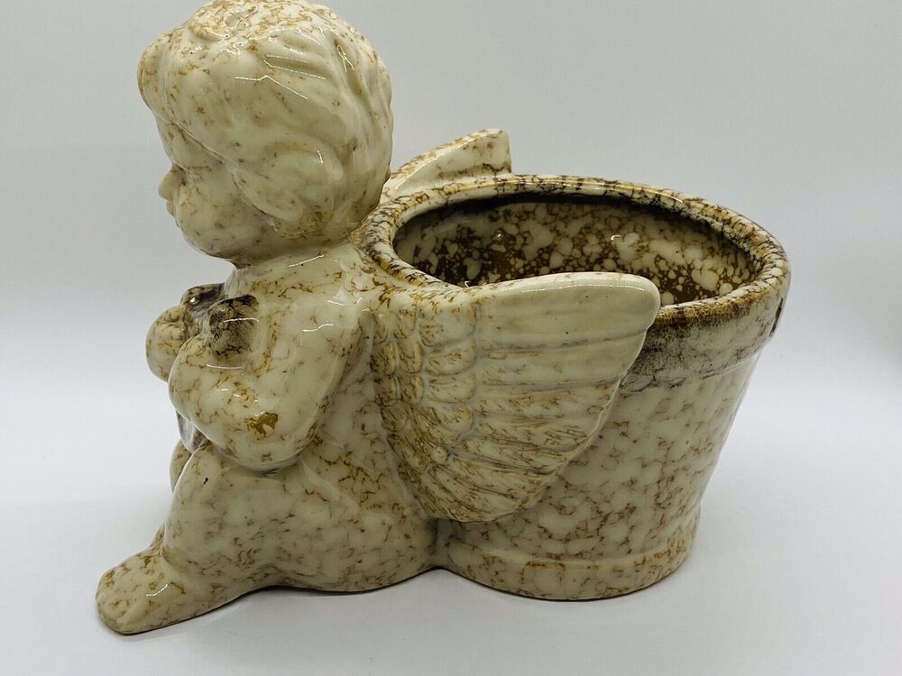 Dimpled Stone Angel Planter With Harp And Wings Extended Around Flower Pot